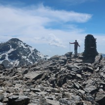 Alfred on the summit of La Alcazaba with Pico de Mulhacén on the left
